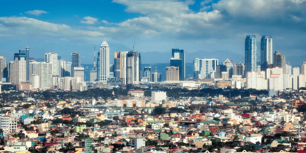 skyline image of highly urbanized philippines with residential houses